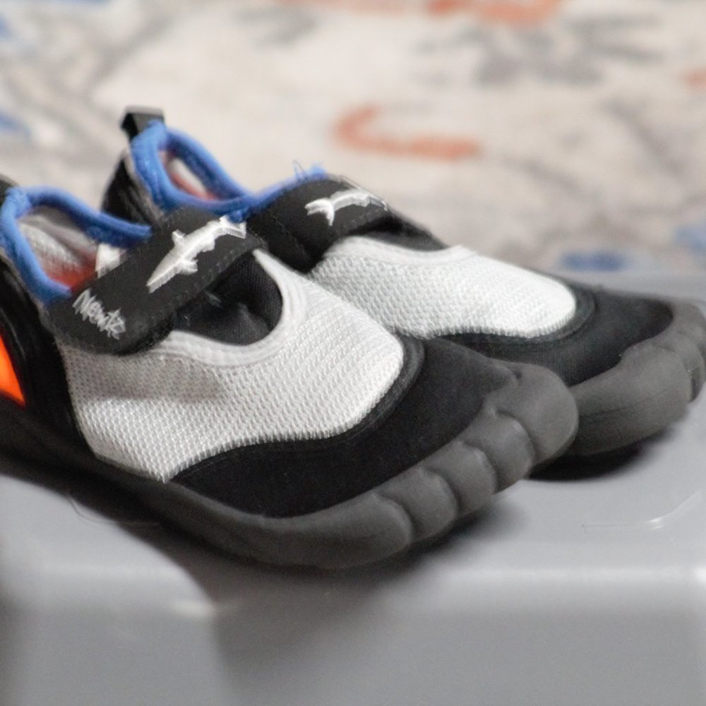 NEW- NEVER USED kids swimming shoes
